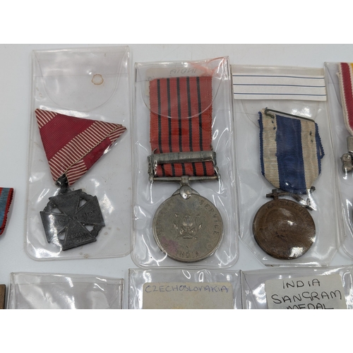 2222 - Ten military medals to include WWII Chinese Commemorative, Indian Sangram, WWI Belgian Volunteers et... 