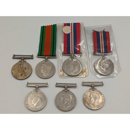 2232 - Seven WWII British medals, three The Defence and four War, one presented to 11337 Spr. Sobhas I. E. ... 