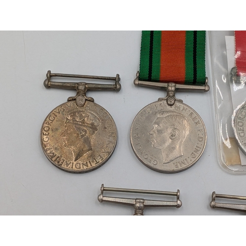 2232 - Seven WWII British medals, three The Defence and four War, one presented to 11337 Spr. Sobhas I. E. ... 