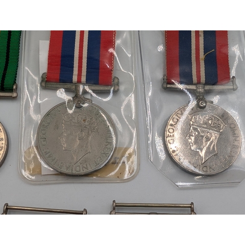 2232 - Seven WWII British medals, three The Defence and four War, one presented to 11337 Spr. Sobhas I. E. ... 