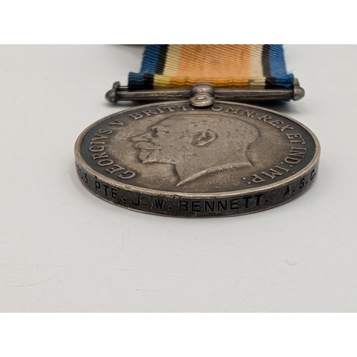 2233 - Two WWI British War medals, one presented to M2-11203 J. W. Bennett A. S. C. and one presented to 23... 