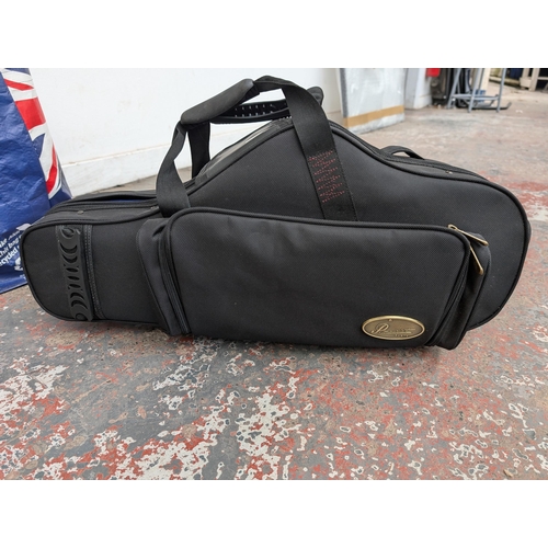 919 - Two items, one P. Mauriat contoured saxophone gig bag and one bag containing a large collection of s... 