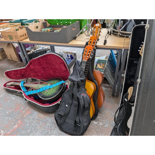 921 - Three nylon strung classical guitars, one cased unbranded child's, one Herald HL34 child's and one T... 