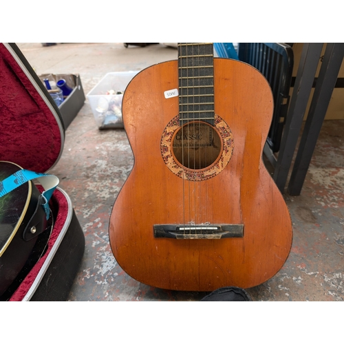 921 - Three nylon strung classical guitars, one cased unbranded child's, one Herald HL34 child's and one T... 