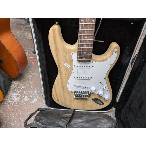 922 - Two Stratocaster style SSS electric guitars, one soft cased JamMate and one Stagg hard cased unbrand... 