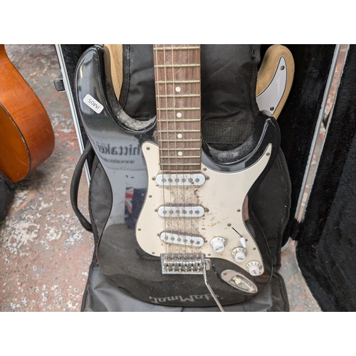 922 - Two Stratocaster style SSS electric guitars, one soft cased JamMate and one Stagg hard cased unbrand... 