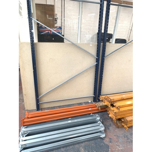 1039A - A blue metal single bay pallet racking system with various orange stretcher bars, aluminium supports... 