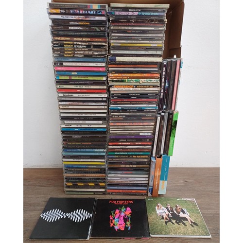 872 - A box containing a collection of CD albums and singles to include Arctic Monkeys, Foo fighters, Haim... 