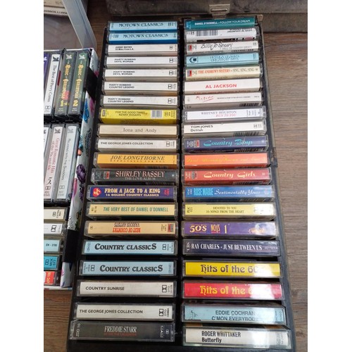 874 - A large collection of compact cassettes to include Chuck Berry, Glen Campbell, Tom Jones, Roy Orbiso... 