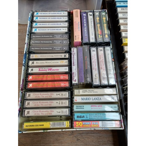 874 - A large collection of compact cassettes to include Chuck Berry, Glen Campbell, Tom Jones, Roy Orbiso... 