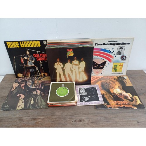 876 - A collection of vinyl records to include The Faces, Mungo Jerry, Mike Harding, Slade, Rod Stewart, T... 