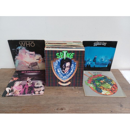 878 - A collection of LP vinyl records to include Elvis Costello, The Who, Rick Springfield, The Strawbs, ... 