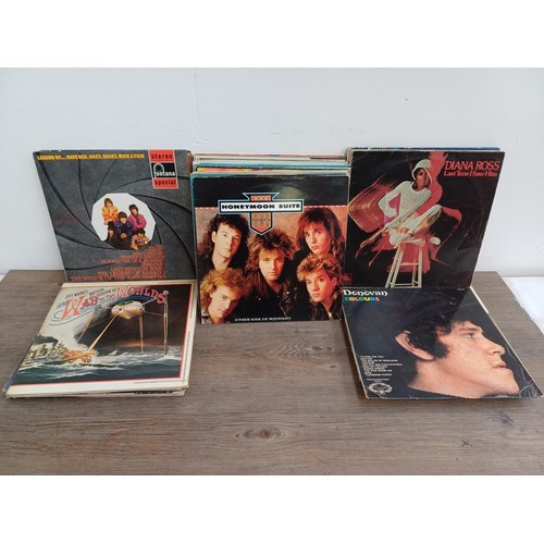 878 - A collection of LP vinyl records to include Elvis Costello, The Who, Rick Springfield, The Strawbs, ... 