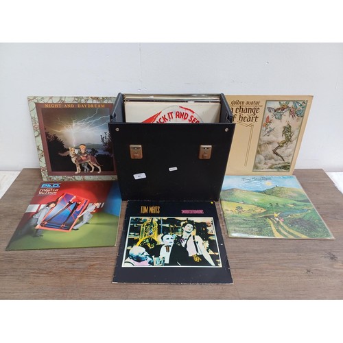 882 - A record case containing vinyl records to include Bauhaus '1979-1983' (BEGA64 - 1985 - limited editi... 