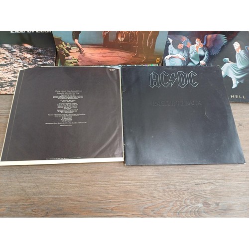 883 - A record case containing a collection of The Who, Pete Townsend, Black Sabbath and ACϟDC vinyl recor... 