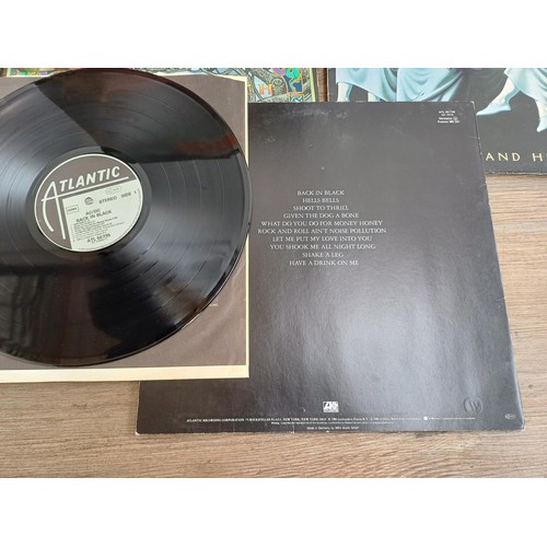 883 - A record case containing a collection of The Who, Pete Townsend, Black Sabbath and ACϟDC vinyl recor... 