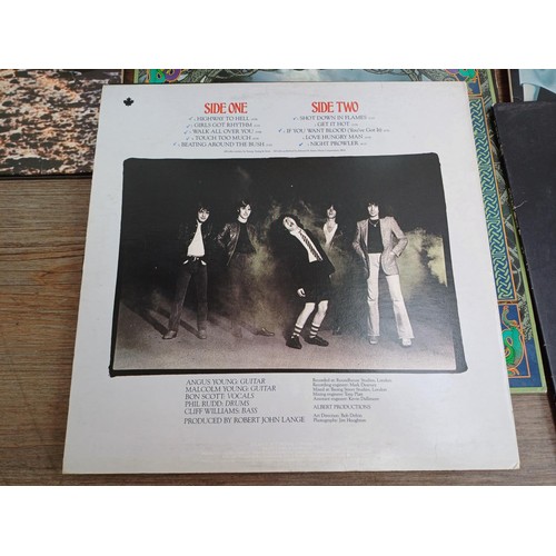 883 - A record case containing a collection of The Who, Pete Townsend, Black Sabbath and ACϟDC vinyl recor... 