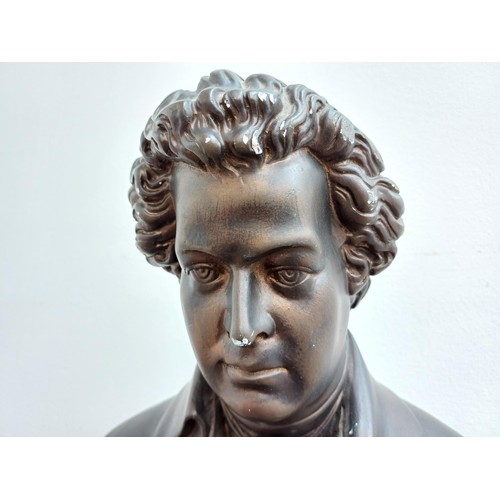 893 - A bronzed plaster bust of Wolfgang Amadeus Mozart - approx. 43cm high