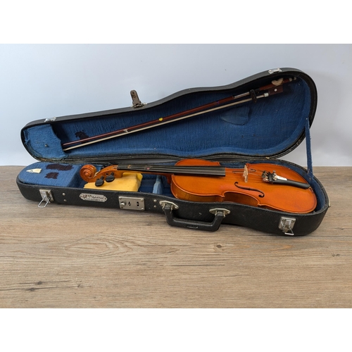 915 - A cased Skylark MV:008 child's student violin with bow and chin rest