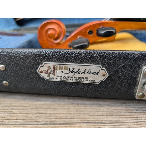 915 - A cased Skylark MV:008 child's student violin with bow and chin rest