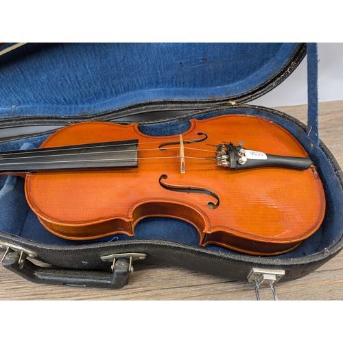 915 - A cased Skylark MV:008 child's student violin with bow and chin rest