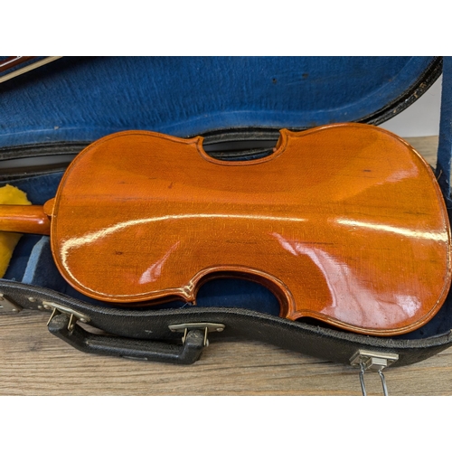 915 - A cased Skylark MV:008 child's student violin with bow and chin rest