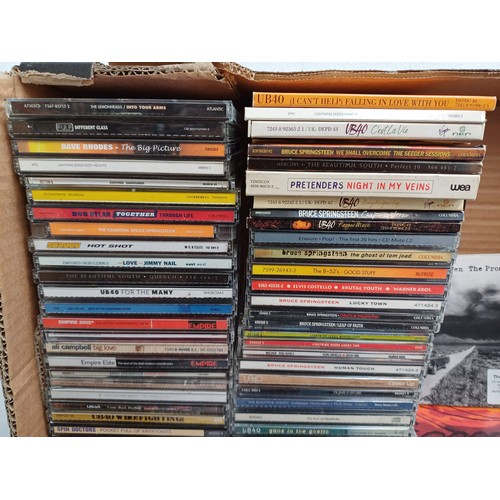 909 - A collection of CDs and books to include Bruce Springsteen 'The Ties That Bind: The River Collection... 