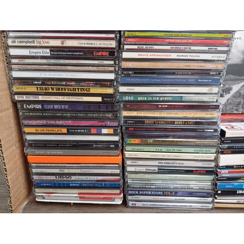 909 - A collection of CDs and books to include Bruce Springsteen 'The Ties That Bind: The River Collection... 