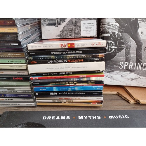 909 - A collection of CDs and books to include Bruce Springsteen 'The Ties That Bind: The River Collection... 