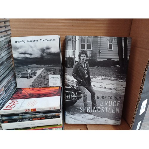 909 - A collection of CDs and books to include Bruce Springsteen 'The Ties That Bind: The River Collection... 