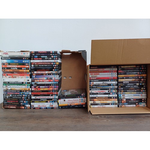 910 - Two boxes containing a collection of DVDs to include The Lethal Weapon Collection, Back to the Futur... 