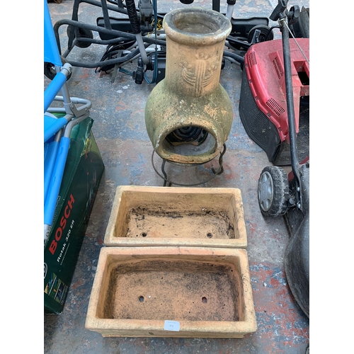 971 - Three terracotta garden items, two rectangular planters and one chiminea