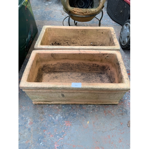 971 - Three terracotta garden items, two rectangular planters and one chiminea