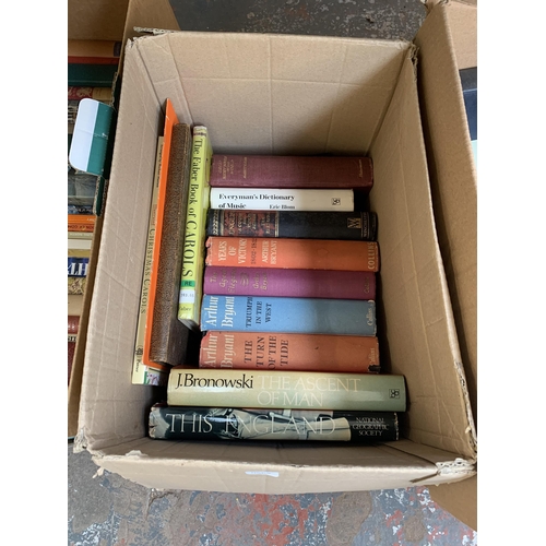 1026 - Four boxes containing books to include authors such as Elizabeth Goudge, William Slim, J. Bronowski ... 