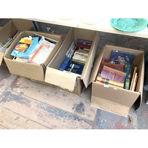 1027 - Three boxes containing books to include authors such as Anthony Sampson, Rudyard Kipling, H. E. Bate... 