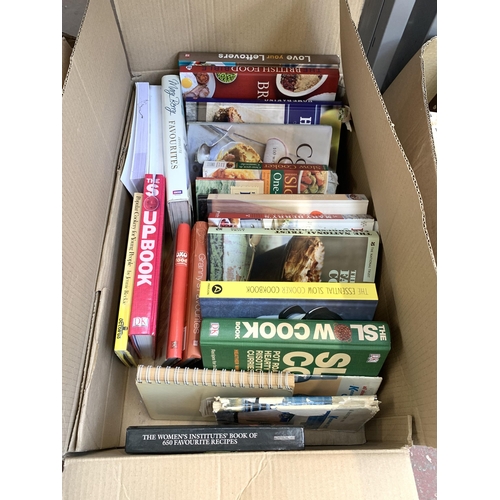 1029 - Five boxes containing books and VHS tapes