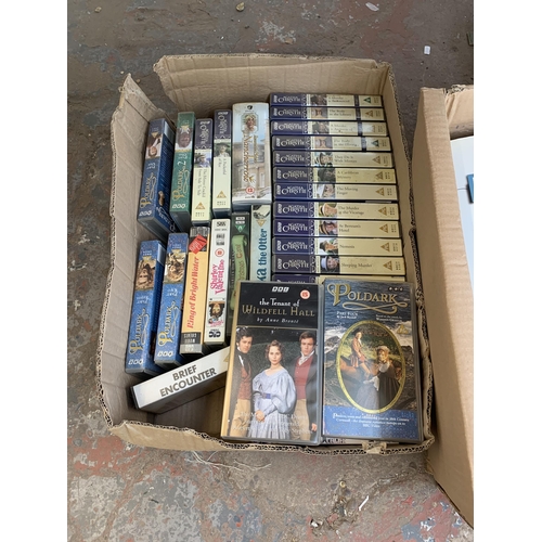 1029 - Five boxes containing books and VHS tapes