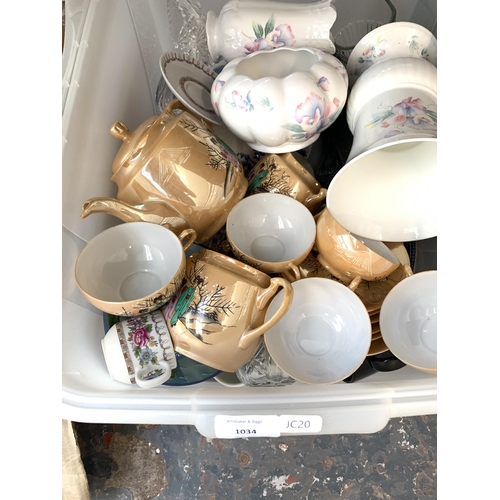 1034 - A box containing Aynsley ceramics, EPNS cutlery, Oriental style tea service etc.