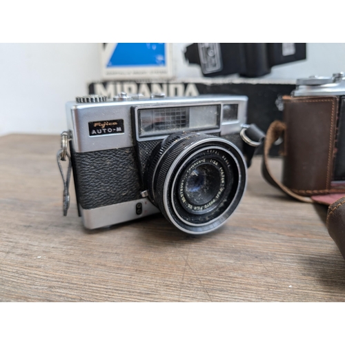606 - A collection of cameras and accessories to include Fujica Auto-M 35mm camera, Canon AT-1 35mm SLR ca... 