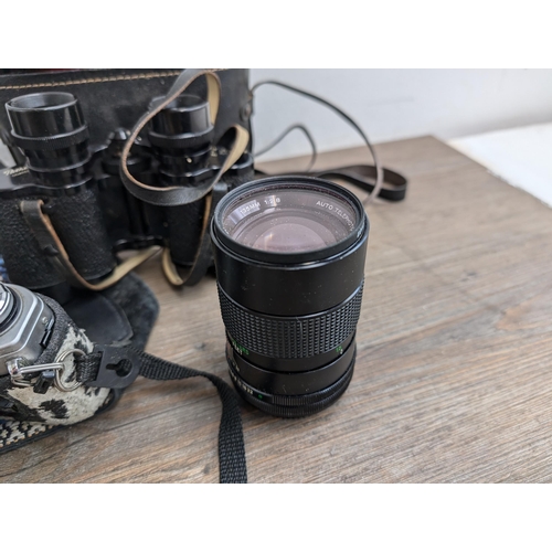 606 - A collection of cameras and accessories to include Fujica Auto-M 35mm camera, Canon AT-1 35mm SLR ca... 