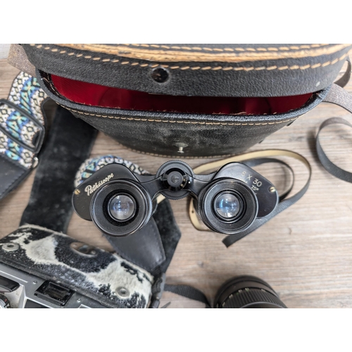 606 - A collection of cameras and accessories to include Fujica Auto-M 35mm camera, Canon AT-1 35mm SLR ca... 