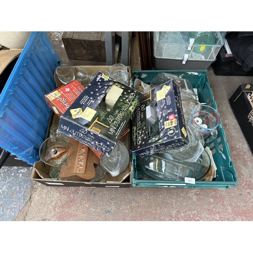 1001 - Two boxes containing glassware to include, Pyrex jugs, wine glasses together with boxed LED lights e... 