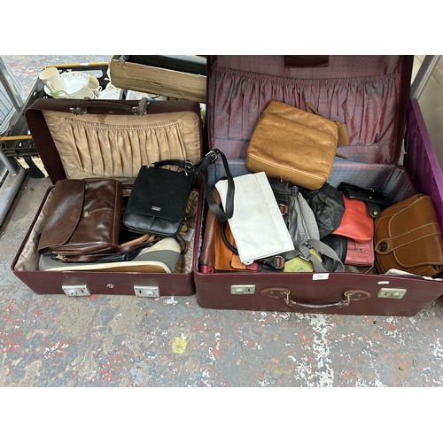 1007 - Two suitcases containing lady's purses and bags