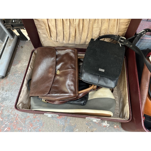 1007 - Two suitcases containing lady's purses and bags