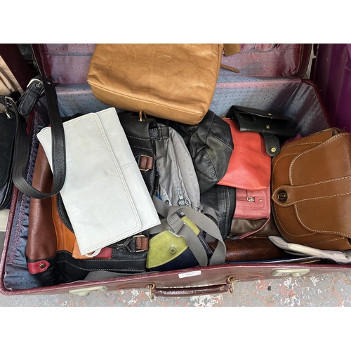 1007 - Two suitcases containing lady's purses and bags