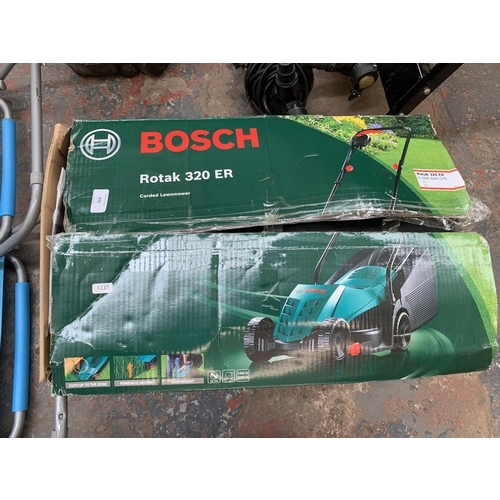 972 - Three items, one boxed Bosch Rotak 320ER electric lawnmower and two low folding camping chairs