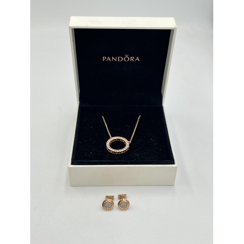 2007 - A boxed Pandora .925 silver and rose gold plated circular CZ pendant necklace and earring set - appr... 