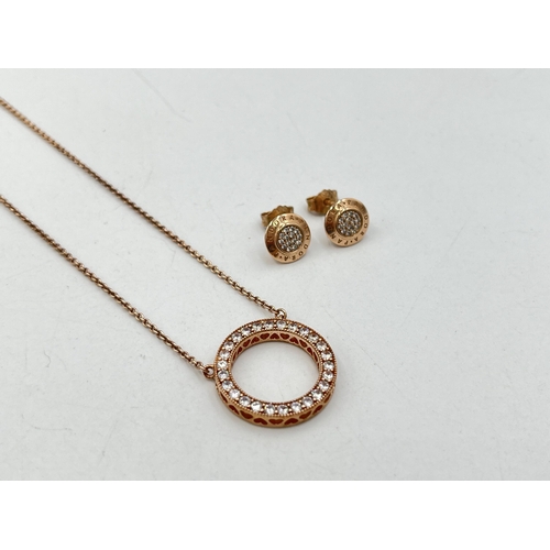 2007 - A boxed Pandora .925 silver and rose gold plated circular CZ pendant necklace and earring set - appr... 