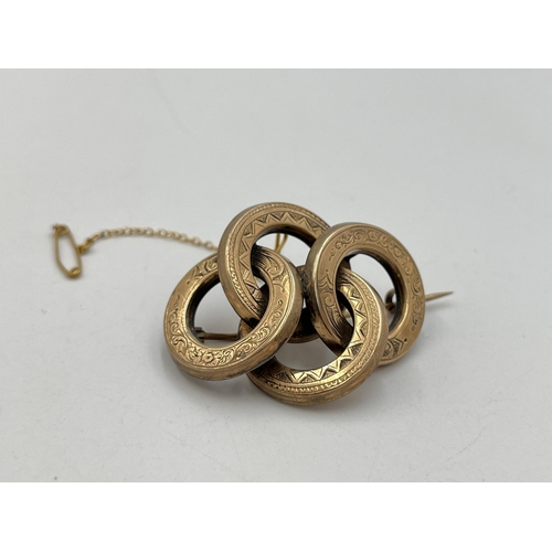 2009 - A Victorian yellow metal love knot brooch - approx. gross weight 11.3g