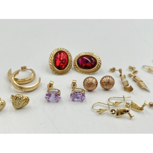 2022 - A collection of 9ct and yellow metal earrings to include 9ct gold pink gemstone earrings, yellow met... 